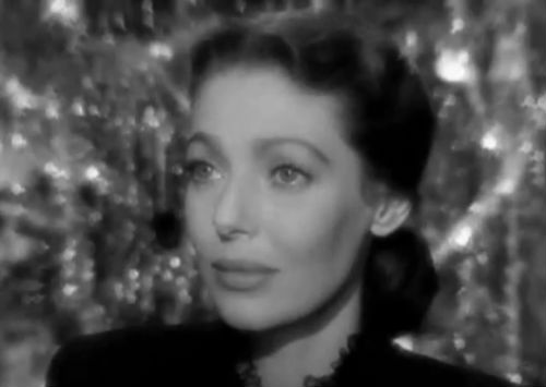 Loretta Young practically glows as devoted yet neglected wife Julia